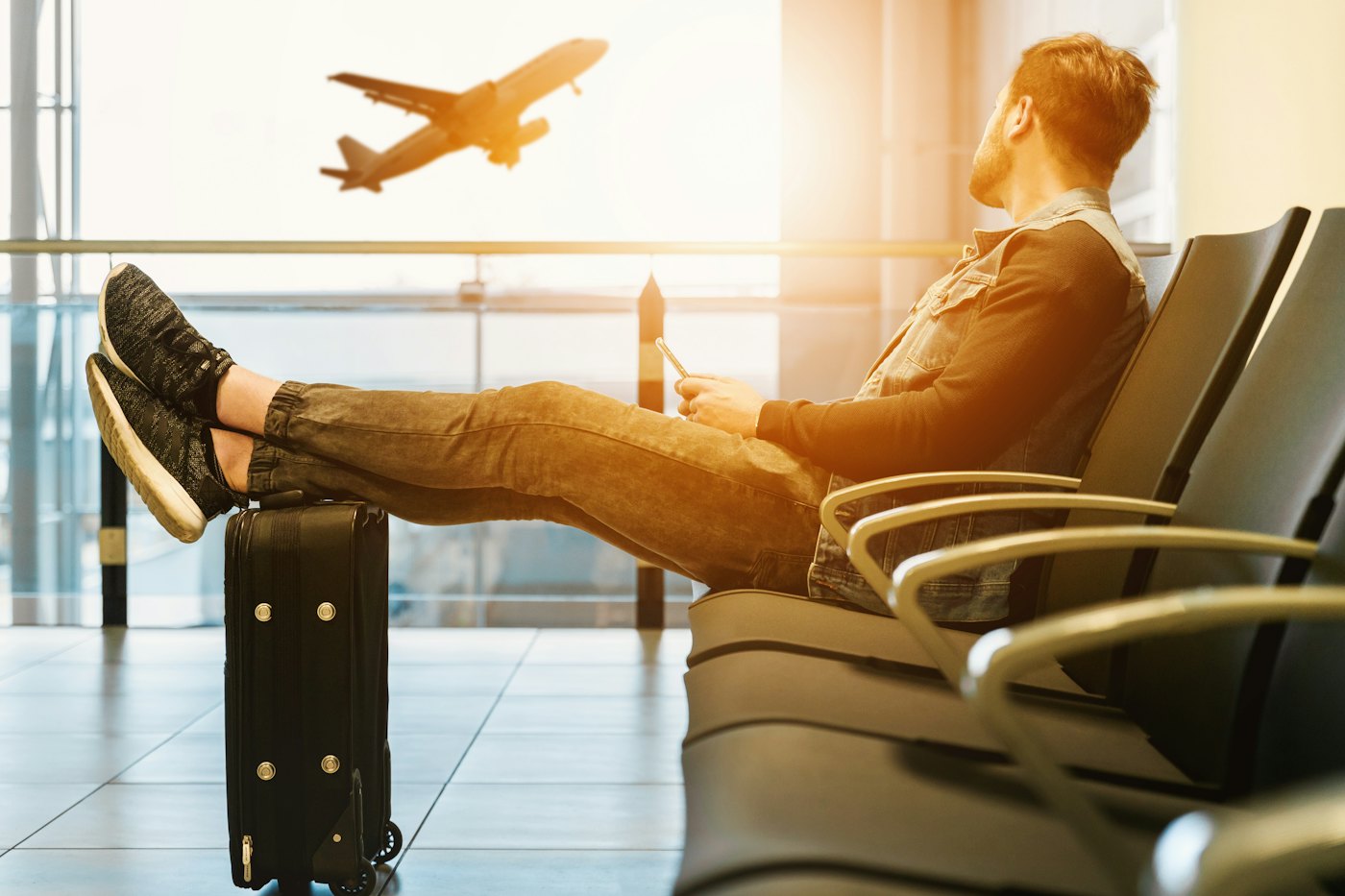 Traveller waiting at an airport gate