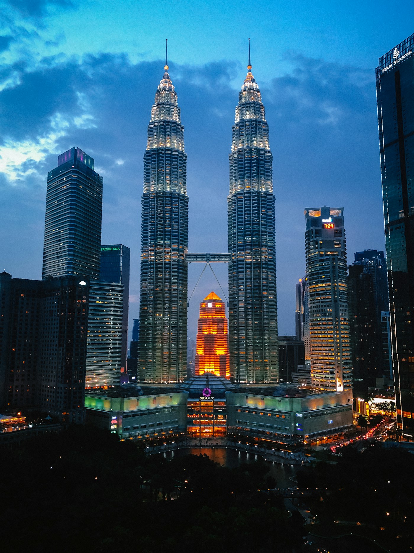 The Petronas Twin Towers lit up at dusk in Kuala Lumpur