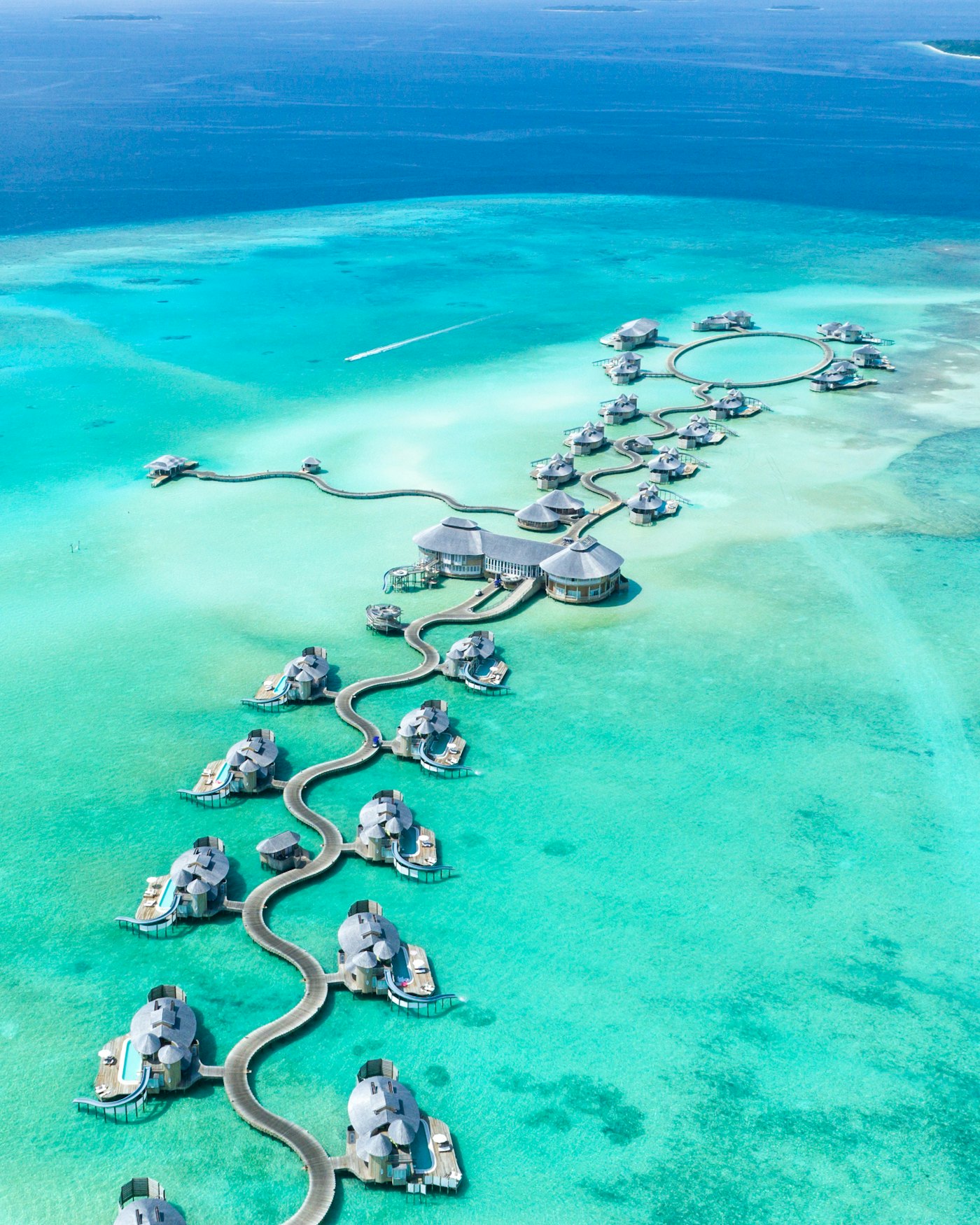 Overwater villas above a turquoise lagoon in the Maldives