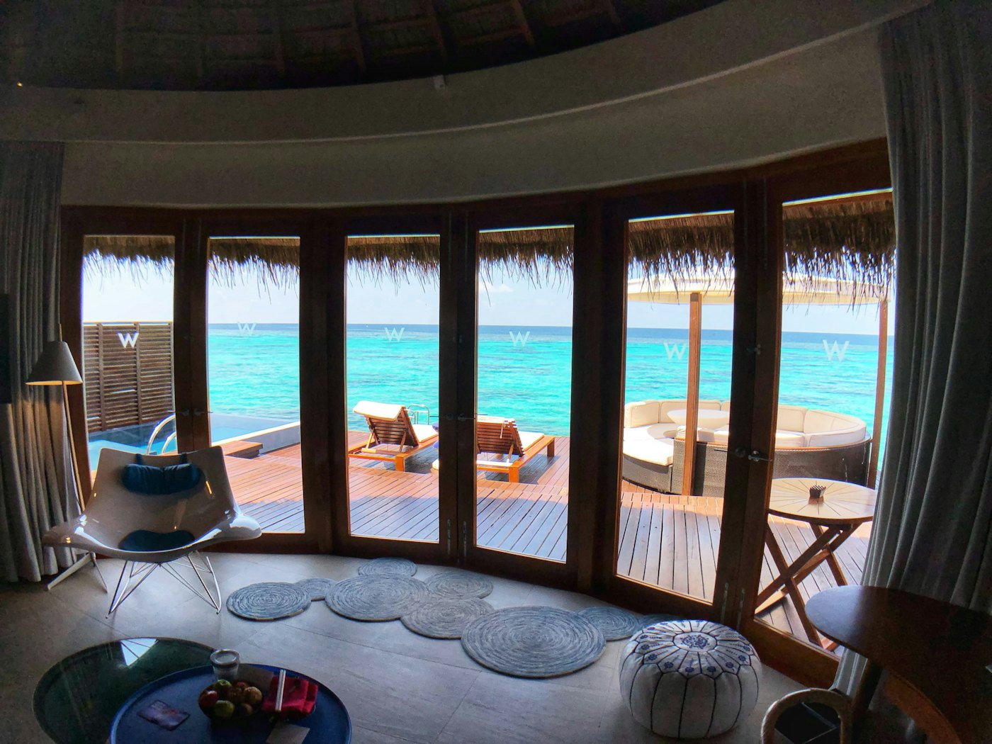 Inside an overwater villa looking out to the ocean